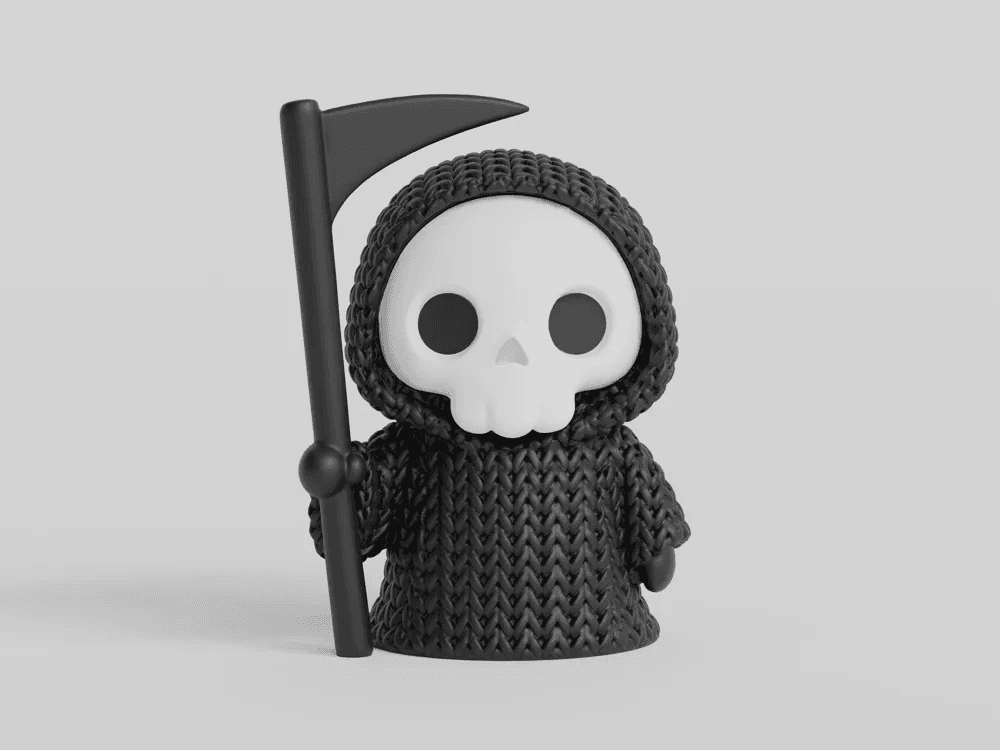 Faucheuse Halloween tricotée noire avec sa faux, vue de face sur fond blanc
